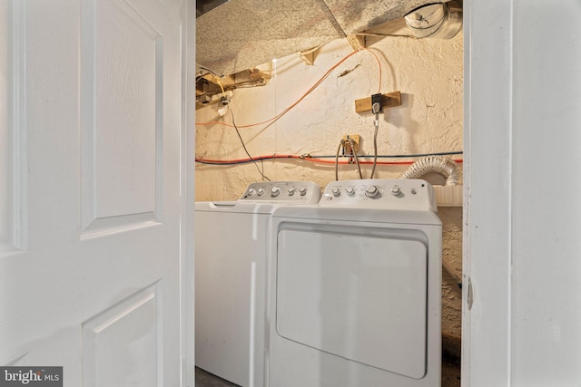 laundry area with separate washer and dryer