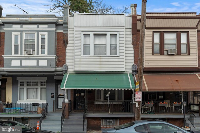 view of front of house featuring cooling unit