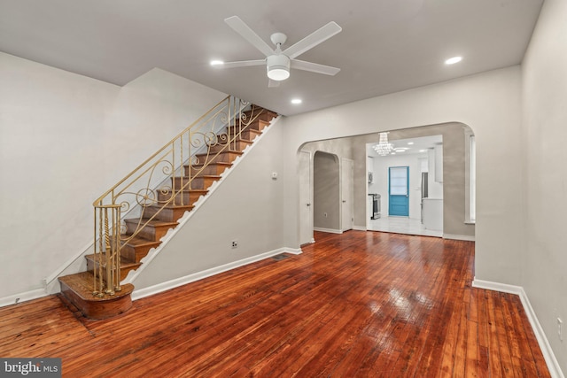 unfurnished living room featuring hardwood / wood-style flooring and ceiling fan