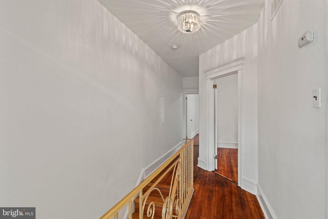 hallway featuring dark hardwood / wood-style flooring