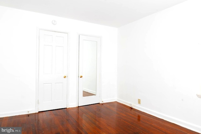 unfurnished bedroom with hardwood / wood-style floors