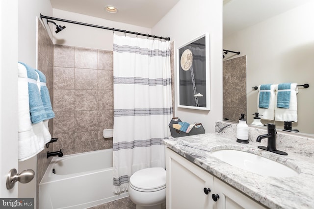 full bathroom with shower / bath combination with curtain, toilet, and vanity