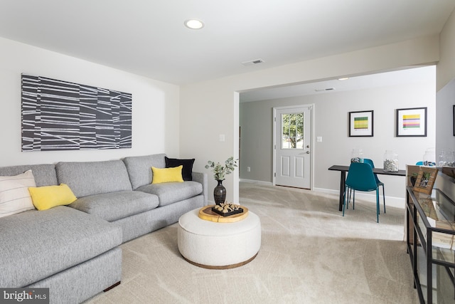 living room with light colored carpet