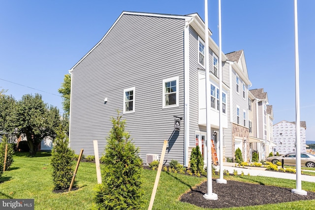 view of property exterior with a lawn