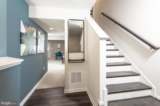 stairs with hardwood / wood-style flooring