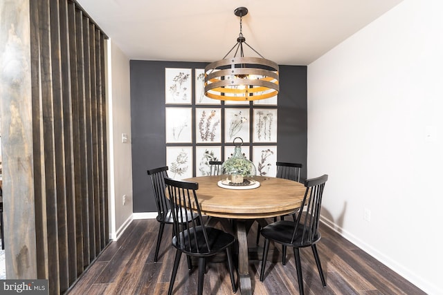 dining space with dark hardwood / wood-style floors