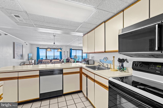 kitchen featuring sink, stainless steel dishwasher, electric range, and kitchen peninsula