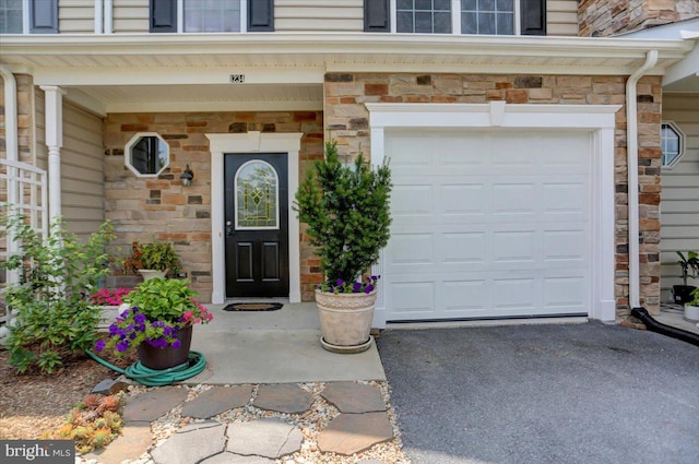 property entrance featuring a garage