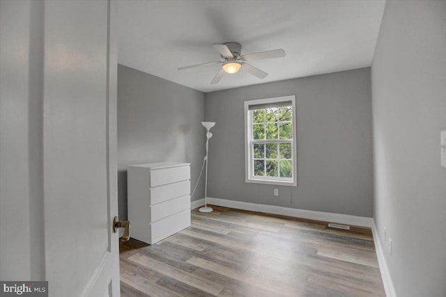 unfurnished bedroom featuring ceiling fan and light wood-type flooring