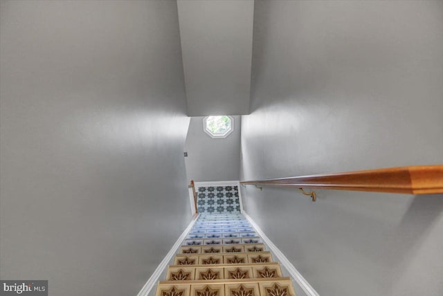 staircase with tile patterned floors