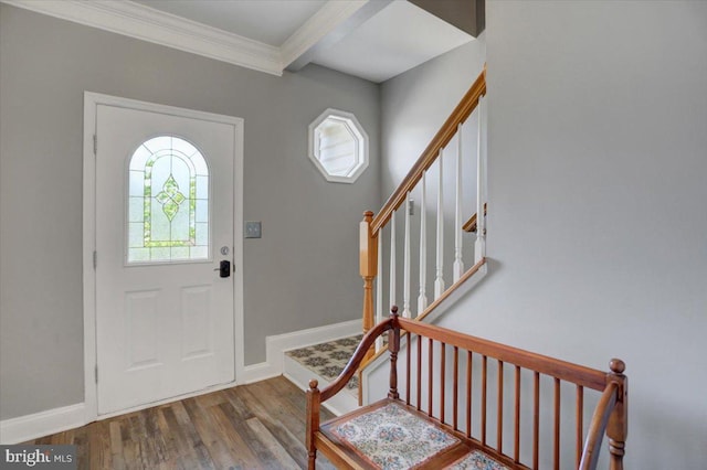 foyer entrance with hardwood / wood-style flooring and ornamental molding