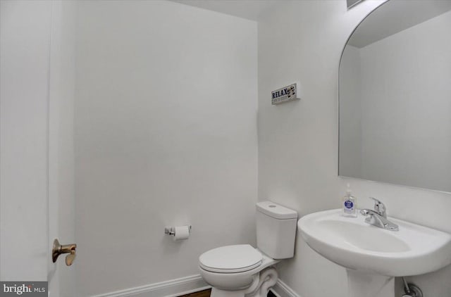 bathroom with sink and toilet