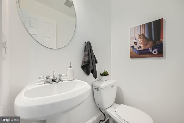 bathroom with sink and toilet