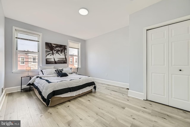 bedroom featuring a closet and light hardwood / wood-style flooring