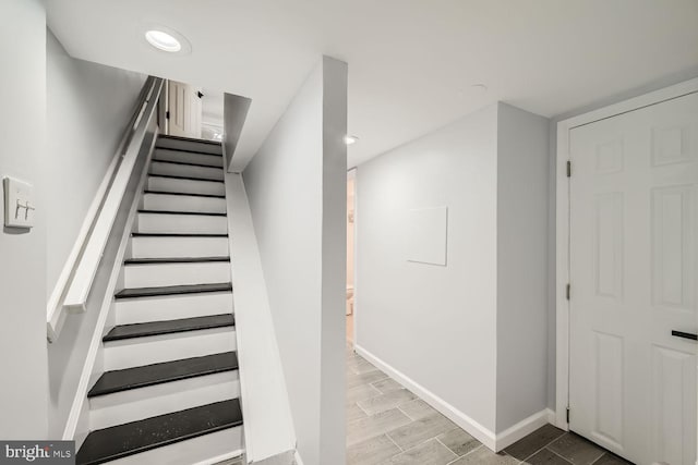 staircase featuring hardwood / wood-style flooring