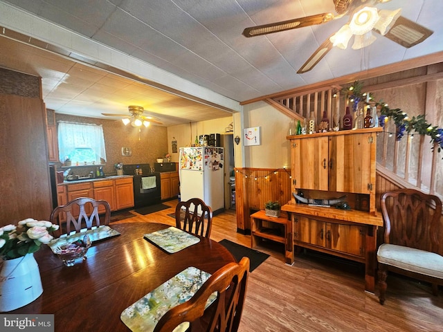 dining room featuring hardwood / wood-style flooring and ceiling fan