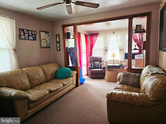 living room with ceiling fan and carpet floors