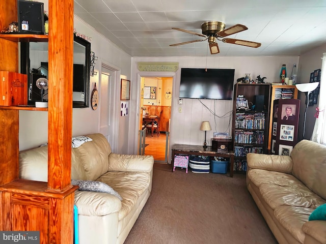 carpeted living room featuring ceiling fan