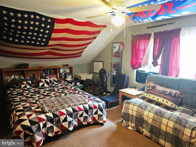 bedroom featuring vaulted ceiling, ceiling fan, and carpet