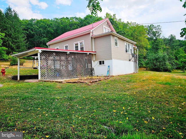 view of property exterior featuring a yard