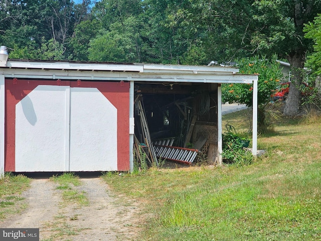 view of outdoor structure with a lawn