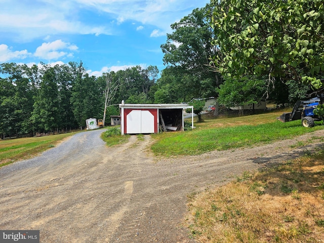 view of outbuilding featuring a lawn