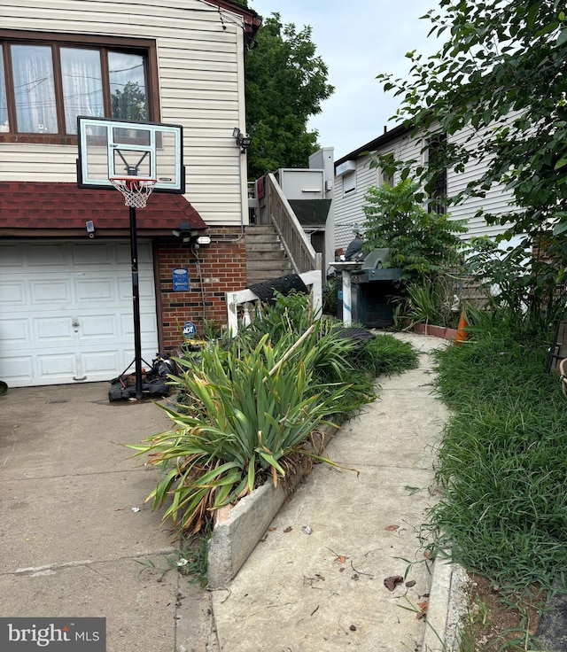 view of side of home with a garage