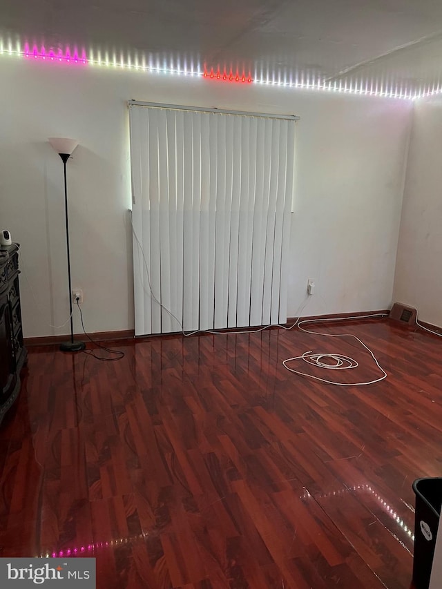 unfurnished room featuring hardwood / wood-style flooring