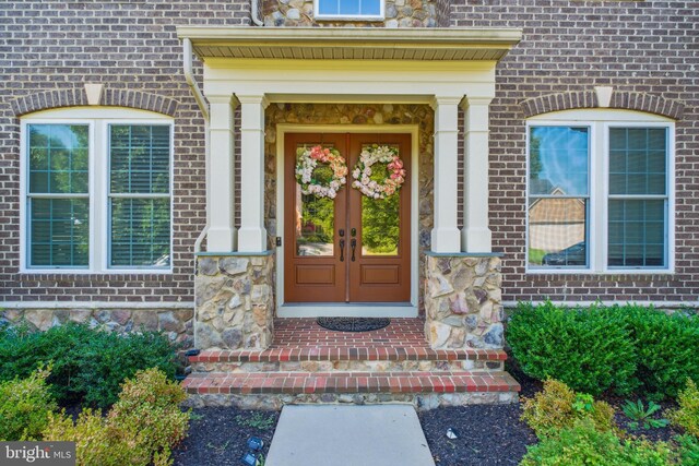 property entrance featuring french doors