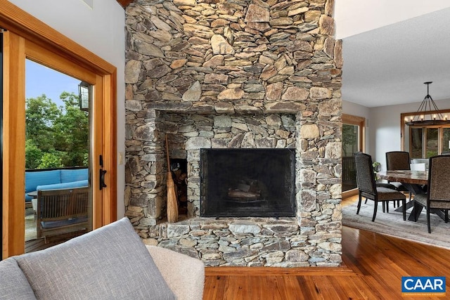 living room featuring hardwood / wood-style flooring and a fireplace