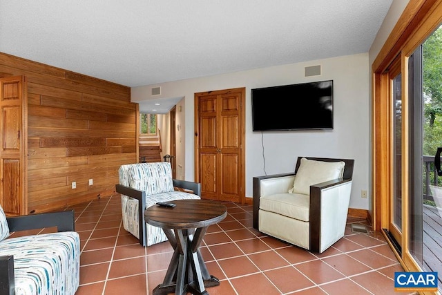 tiled living room with wood walls