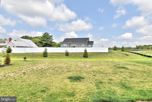 view of yard with a rural view