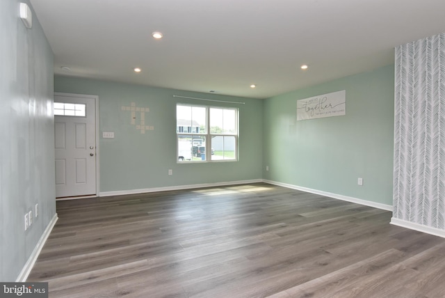 empty room featuring hardwood / wood-style flooring