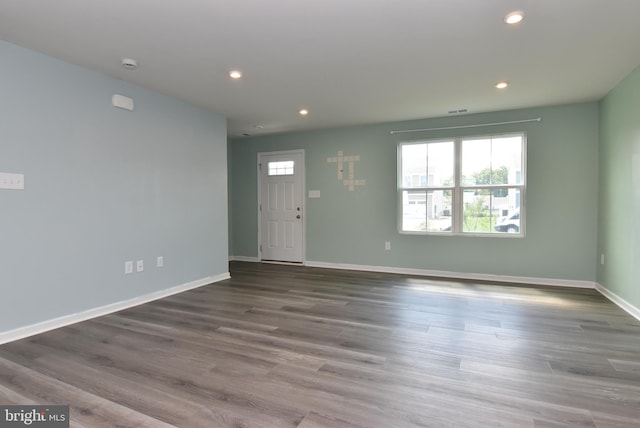 interior space with wood-type flooring and a healthy amount of sunlight