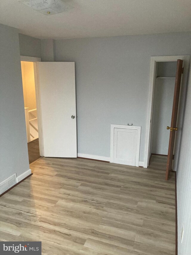 spare room with light wood-type flooring