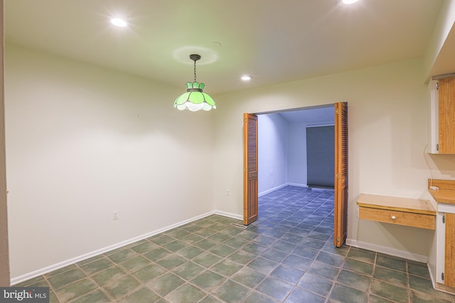 unfurnished dining area featuring baseboards and recessed lighting