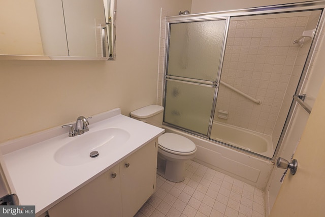 full bath featuring toilet, shower / bath combination with glass door, tile patterned floors, and vanity