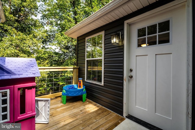 property entrance with a deck