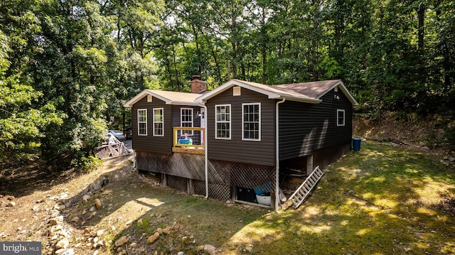 exterior space featuring a lawn and a wooden deck