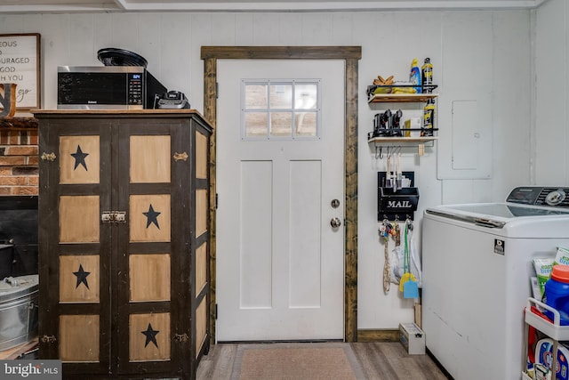 laundry area with washer / dryer and hardwood / wood-style floors