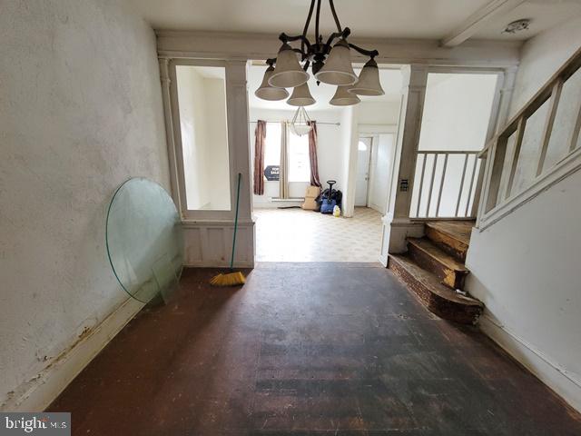 interior space featuring a notable chandelier and hardwood / wood-style floors