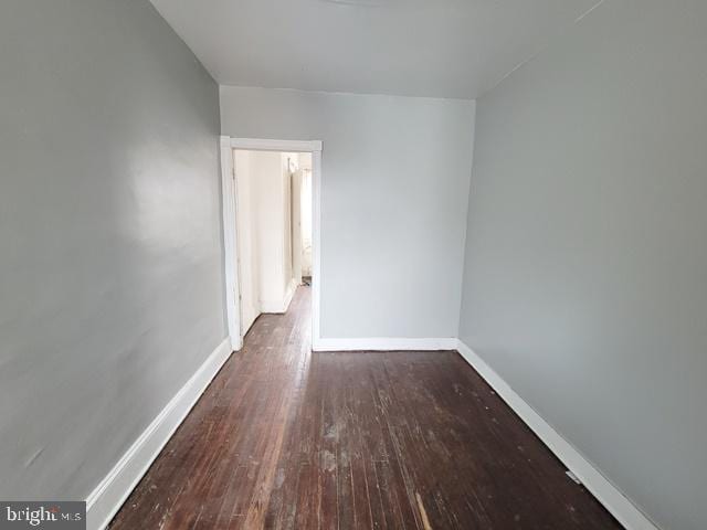 unfurnished room featuring wood-type flooring