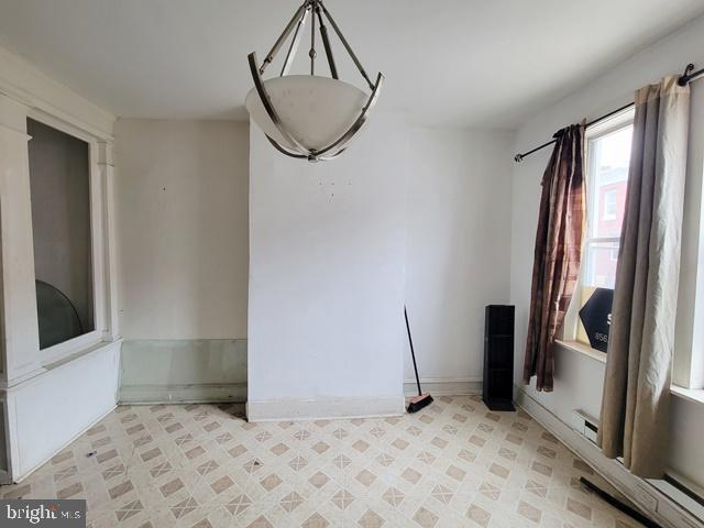 empty room with light tile patterned floors