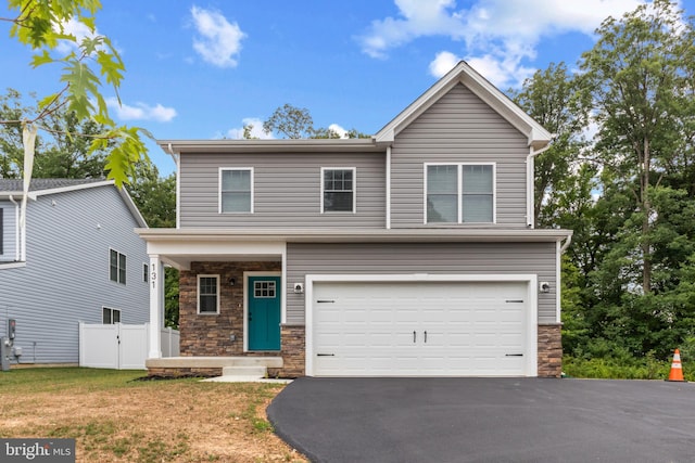 view of front of property with a garage