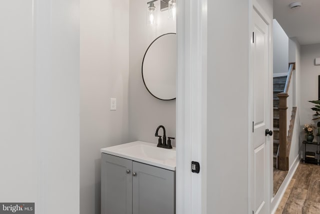 bathroom featuring hardwood / wood-style floors and vanity