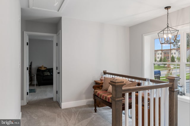 bedroom with a notable chandelier and light colored carpet