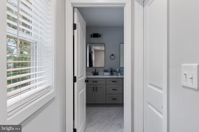 bathroom with tile patterned floors and vanity