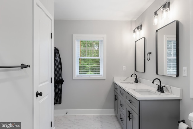 bathroom featuring tile patterned floors and dual bowl vanity