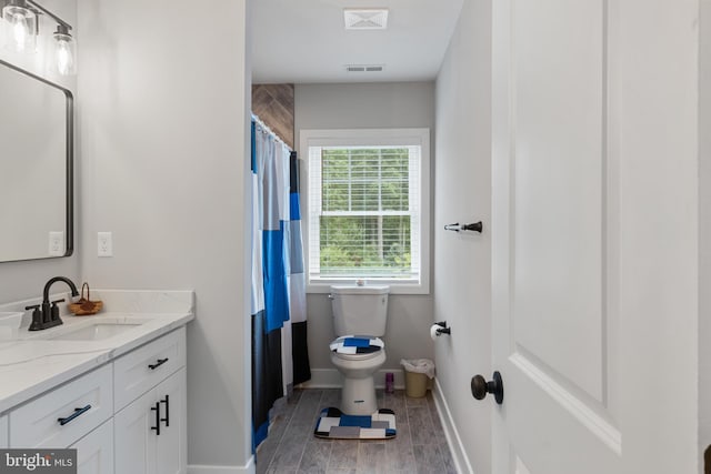 bathroom with vanity and toilet