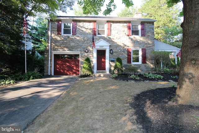 colonial inspired home with a garage